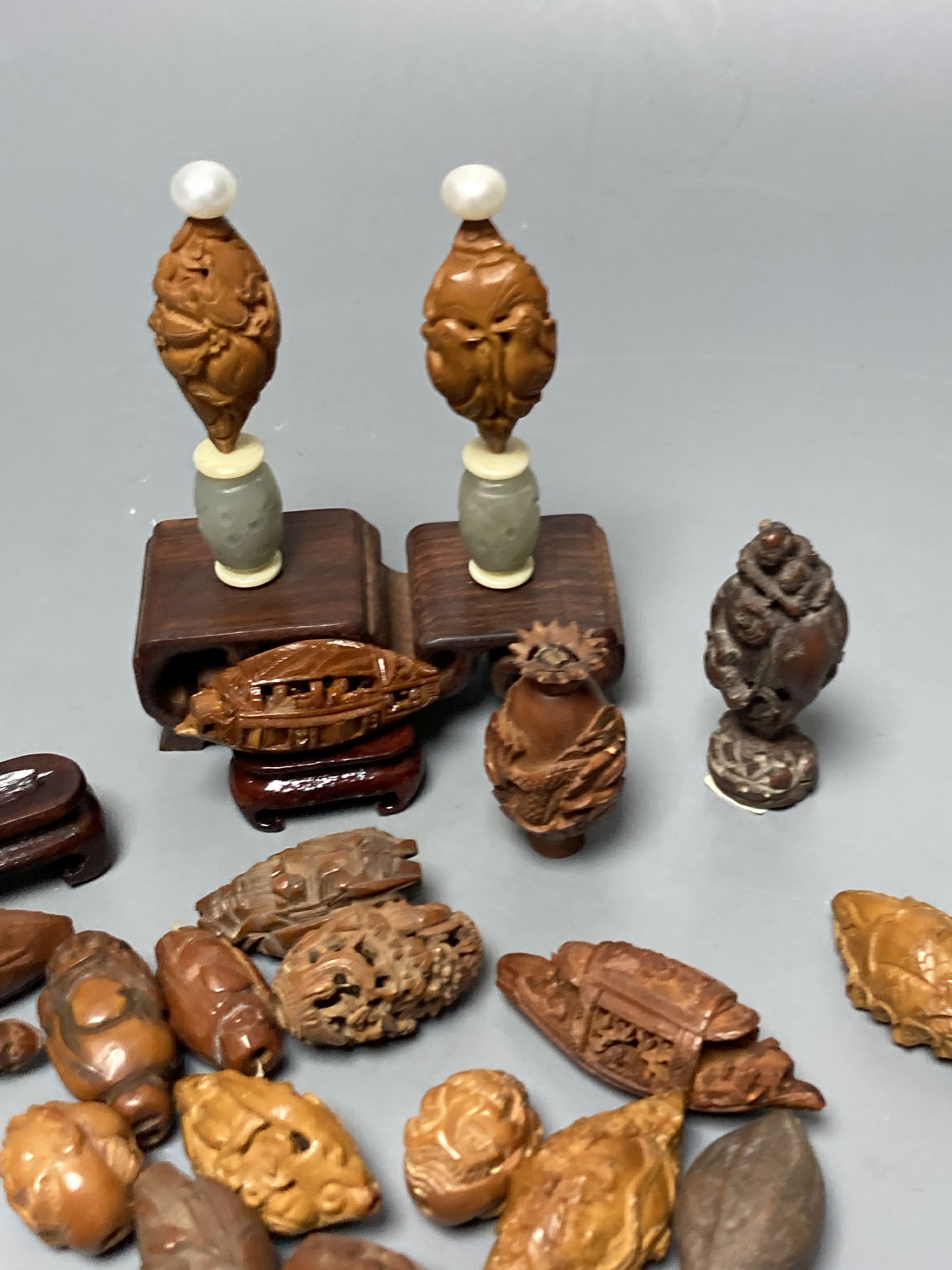 A group of Chinese peach stone carvings